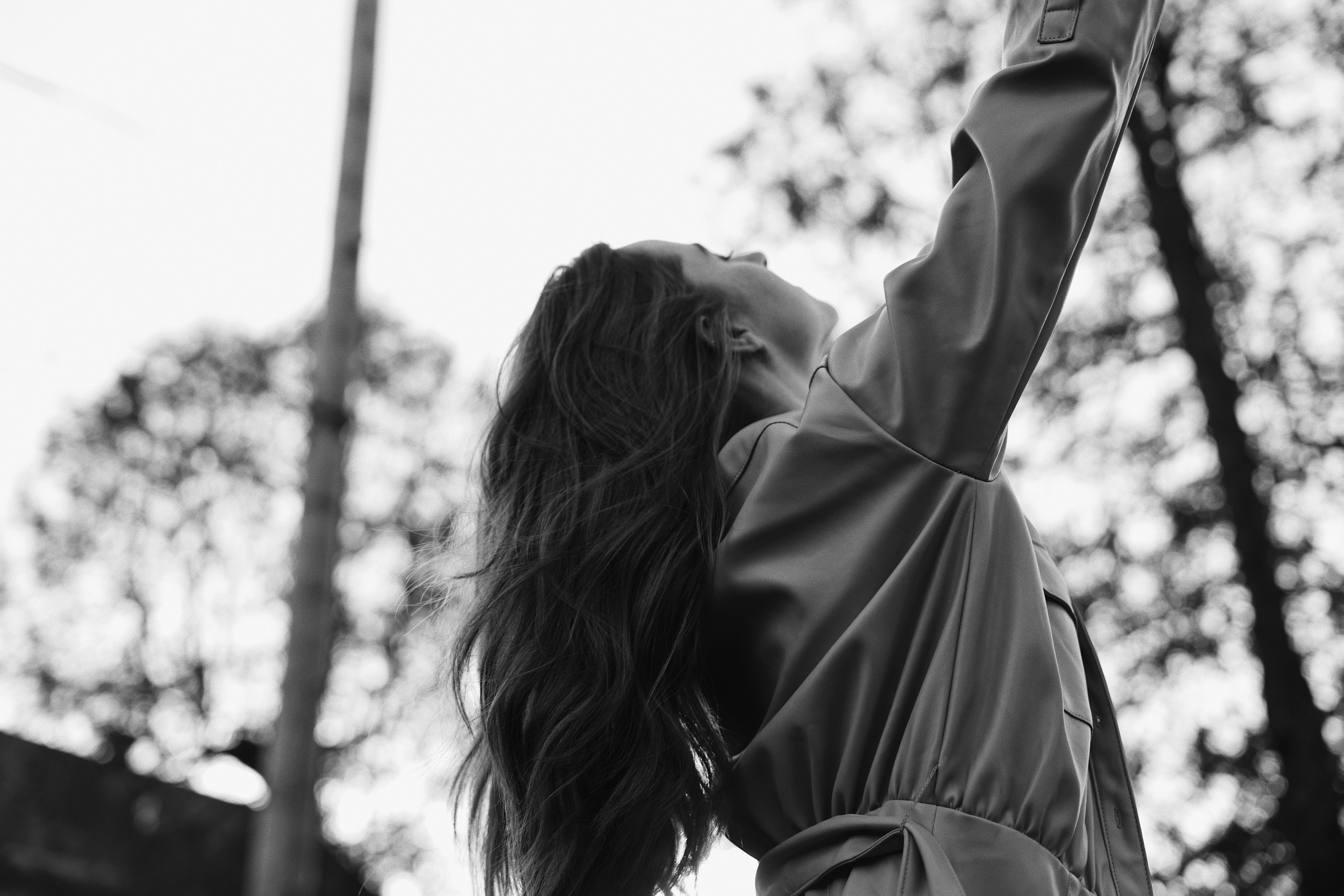 grayscale photo of woman in long sleeve shirt